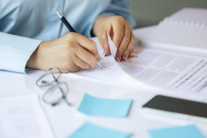 Close up of female hands signing business contract. Concept of female business, online education, professional occupation Close up of female hands signing business contract. Concept of female business, online education, professional occupation