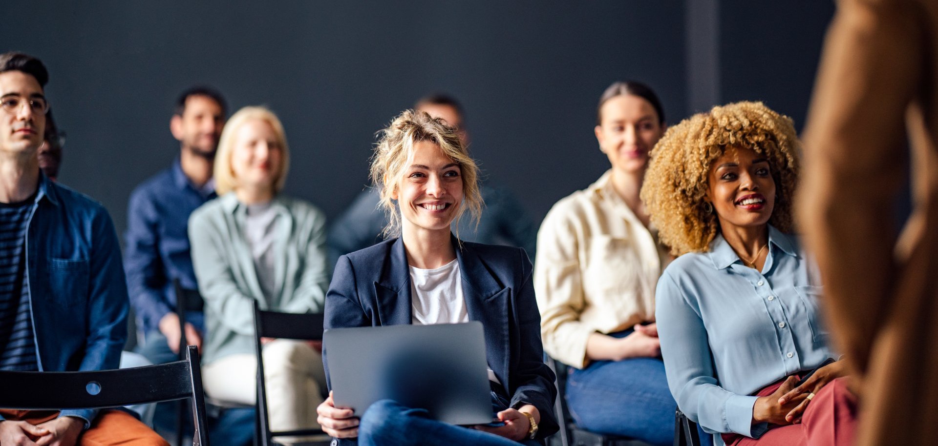 Group of Cheerful People on a Seminar