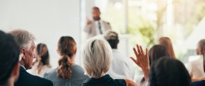 Presentation, question and speaker with business people in office for conference, training and meeting. Corporate, answer and workers with hands raised in discussion, convention and finance seminar Presentation, question and speaker with business people in office for conference, training and meeting. Corporate, answer and workers with hands raised in discussion, convention and finance seminar